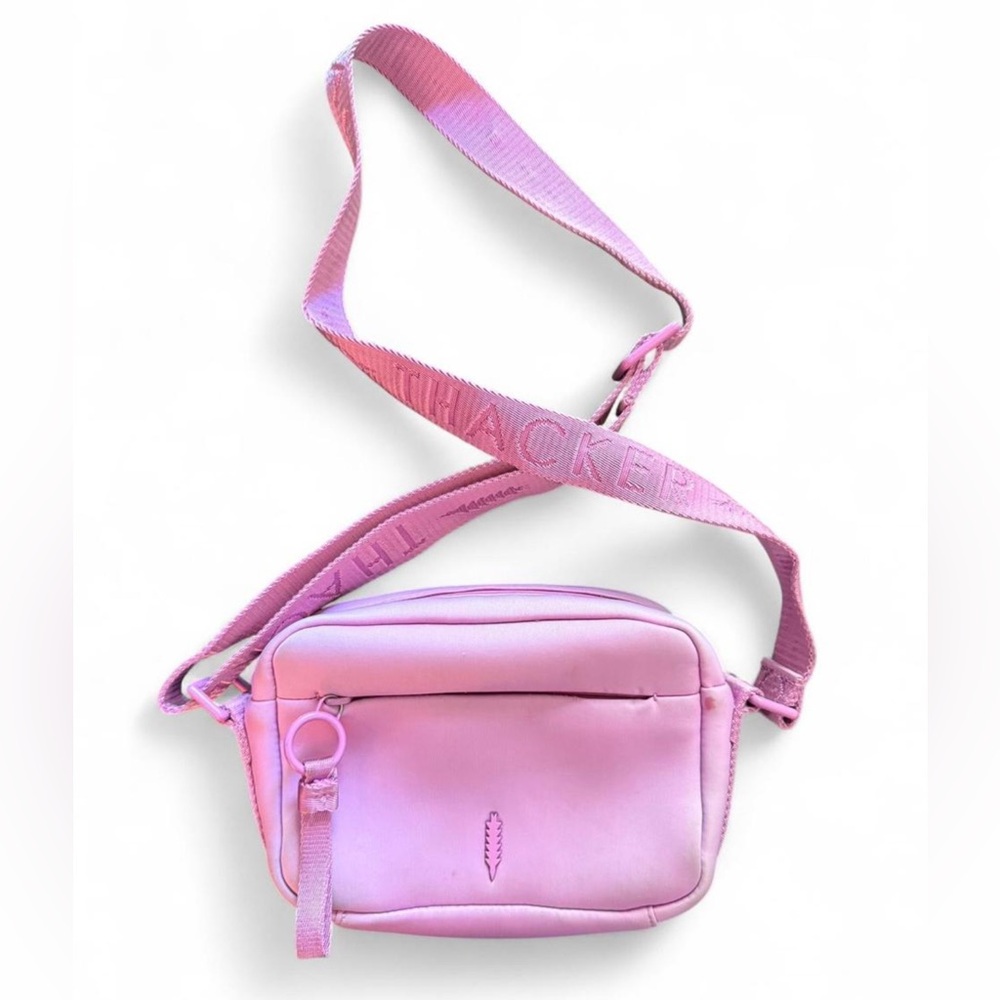 THACKER “Ella” crossbody bag in lilac. Made of neoprene and is water resistant